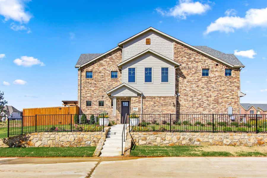 Front exterior of a home in the Wildridge community, located in Oak Point, TX (Image 5). Front exterior of a home in the Wildridge community, located in Oak Point, TX (Image 5).