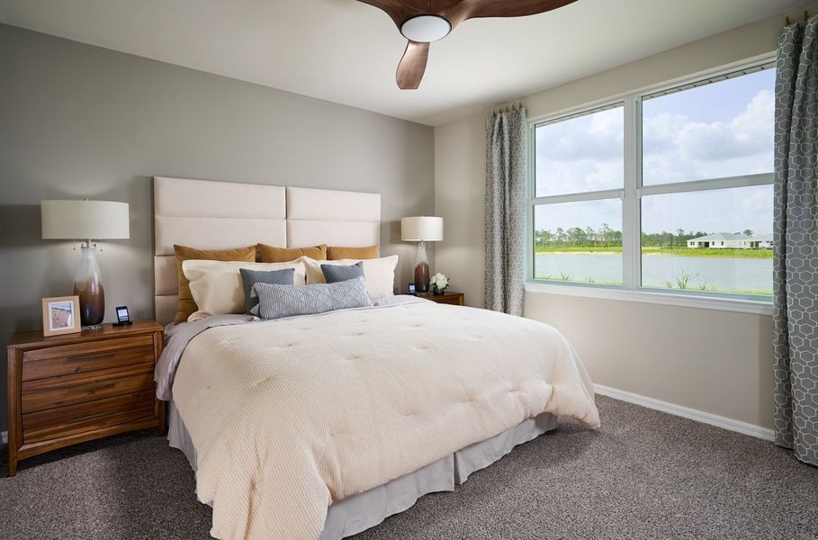 Primary bedroom in the Canary floorplan modeled at Crescent Lakes at Babcock Ranch Primary bedroom in the Canary floorplan modeled at Crescent Lakes at Babcock Ranch