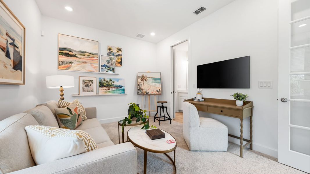 Furnished interior in a model home at Esplanade at Coasterra in Palmetto (Image 40).