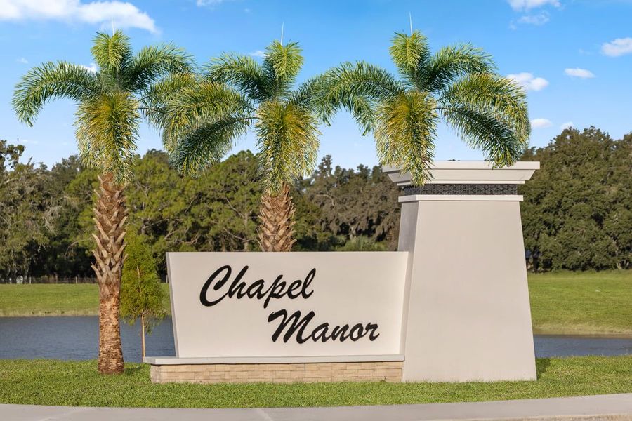 Entrance to the Chapel Manor II community in Zephyrhills, FL, featuring signage and landscaping (Image 1). Entrance to the Chapel Manor II community in Zephyrhills, FL, featuring signage and landscaping (Image 1).