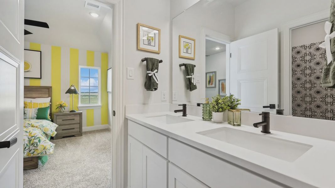 Luxurious dual sinks and elegant fixtures enhance this vibrant Green Meadows home. Luxurious dual sinks and elegant fixtures enhance this vibrant Green Meadows home.