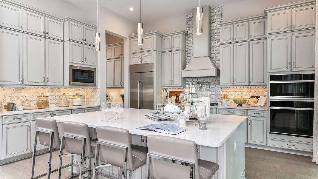 Furnished interior in a model home at Esplanade by the Islands in Naples (Image 66).