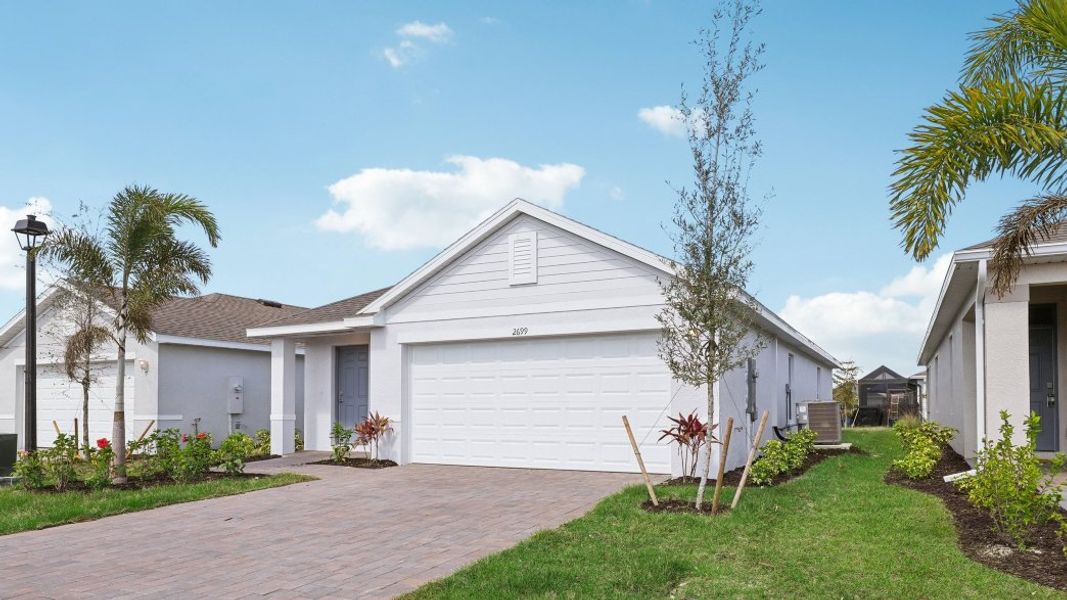 Front exterior of a home in the Asher Park community, located in Lehigh Acres, FL (Image 13).