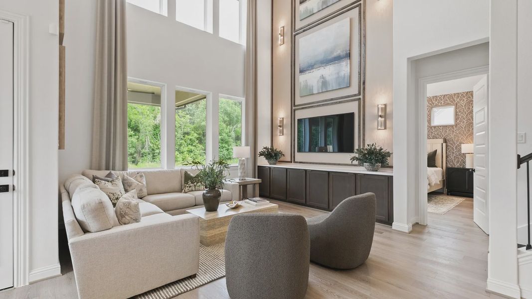 High ceilings and expansive windows illuminate this sophisticated living space in Katy Lakes, offering serene elegance. High ceilings and expansive windows illuminate this sophisticated living space in Katy Lakes, offering serene elegance.