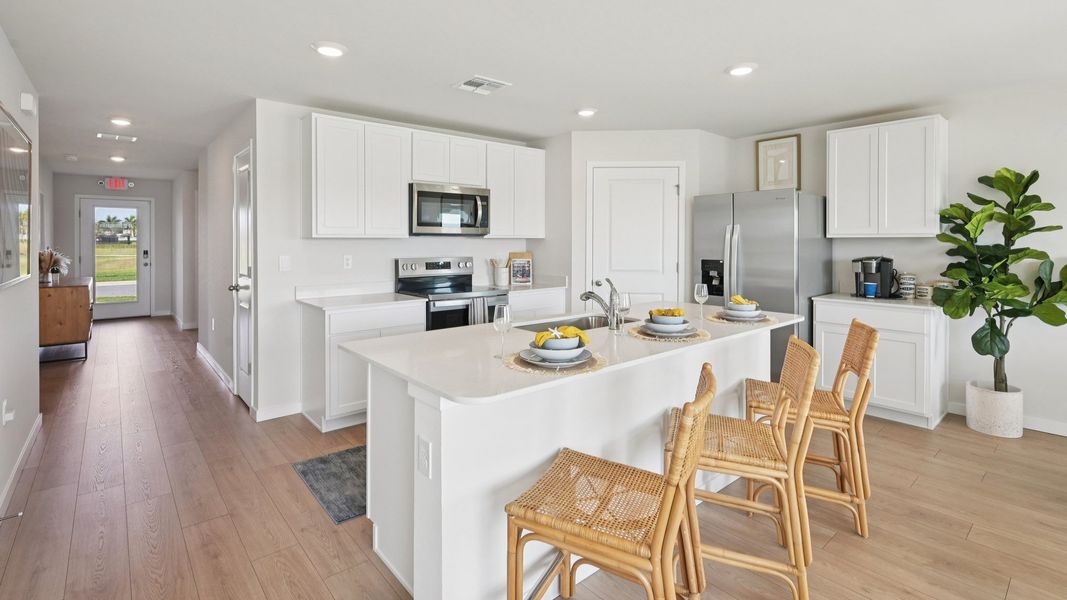 Furnished interior in a model home at Cove at West Port - Express in Port Charlotte (Image 25).