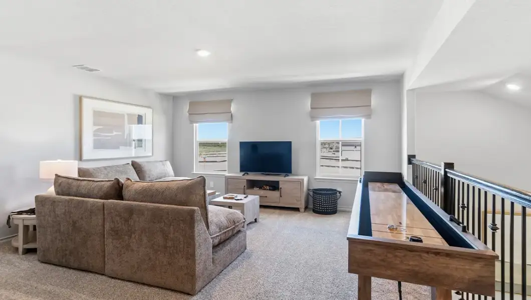 Furnished interior in a model home at The Woodlands at Medina Hills in Mico (Image 37).
