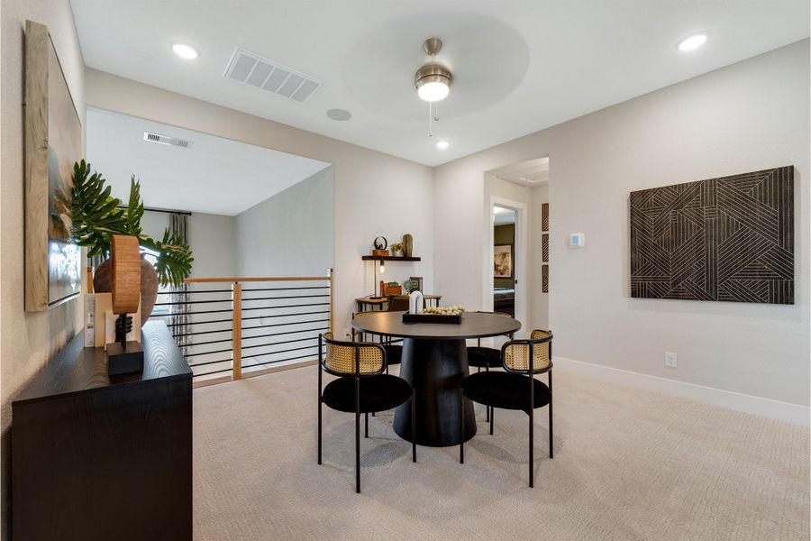 Furnished interior in a model home at Sunterra Lakes in Brookshire (Image 38).