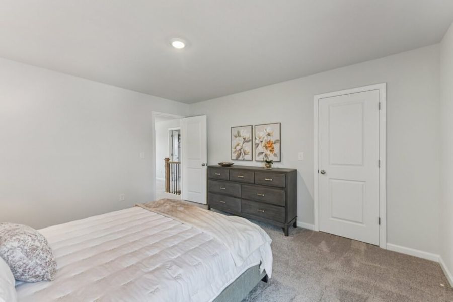 Furnished interior in a model home at The Hills at Cedar Creek in Winder (Image 64).
