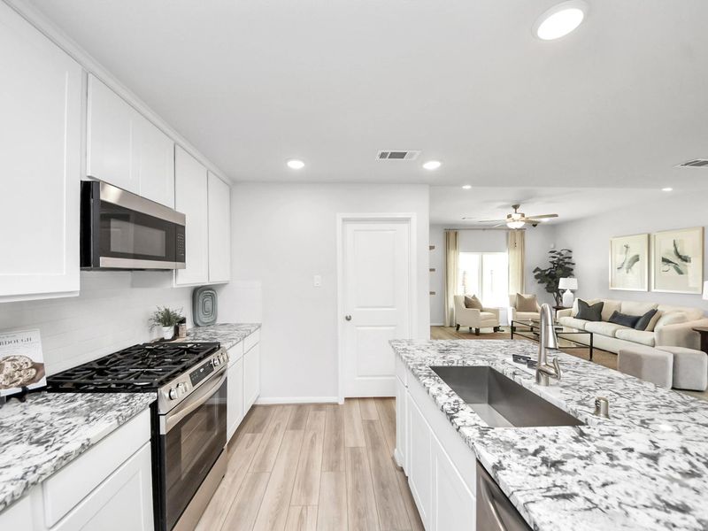 Furnished interior in a model home at Sunterra in Katy (Image 8).
