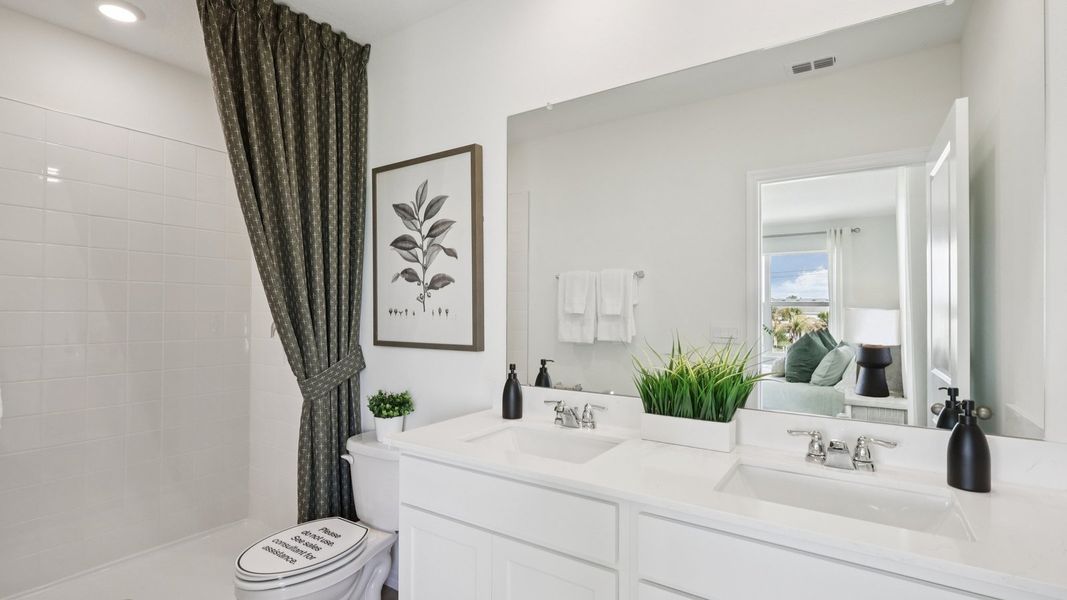 Furnished interior in a model home at Towns at Woodsdale in Wesley Chapel (Image 18).