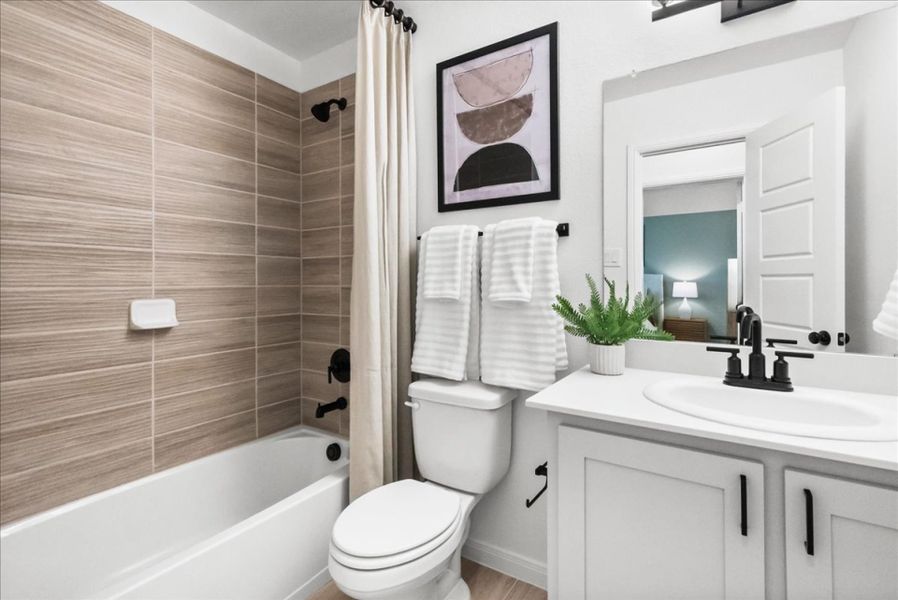 Furnished interior in a model home at The Reserve at Spiritas Ranch in Little Elm (Image 35).