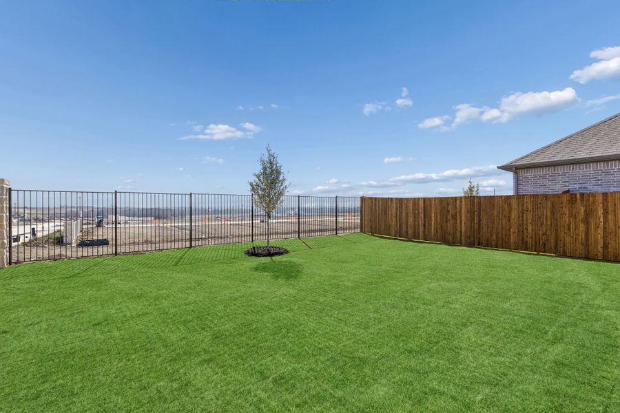 Covered Patio in a Nicholson Ranch Magnolia Model Home in Lavon TX by Trophy Signature Homes