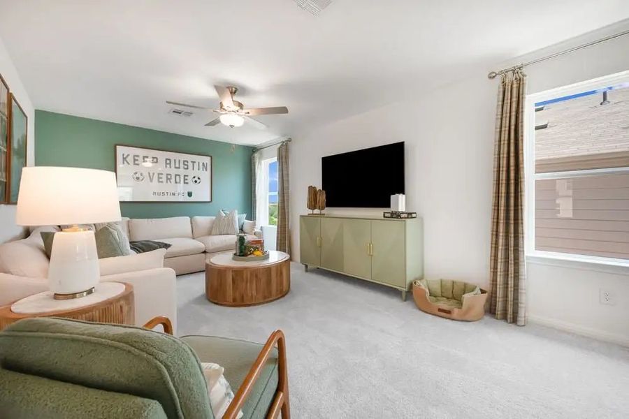 Furnished interior in a model home at Village Grove in Dripping Springs (Image 4).