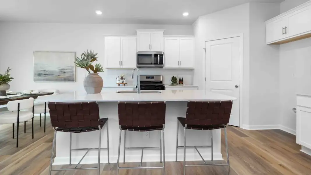 Furnished interior in a model home at Sweetwater Village in Rockwell (Image 6).