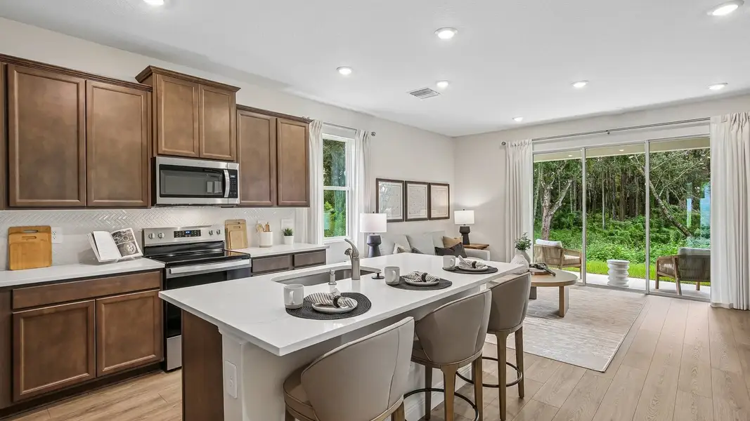 Furnished interior in a model home at Sanctuary at Citrus Park Townhomes in Tampa (Image 6).
