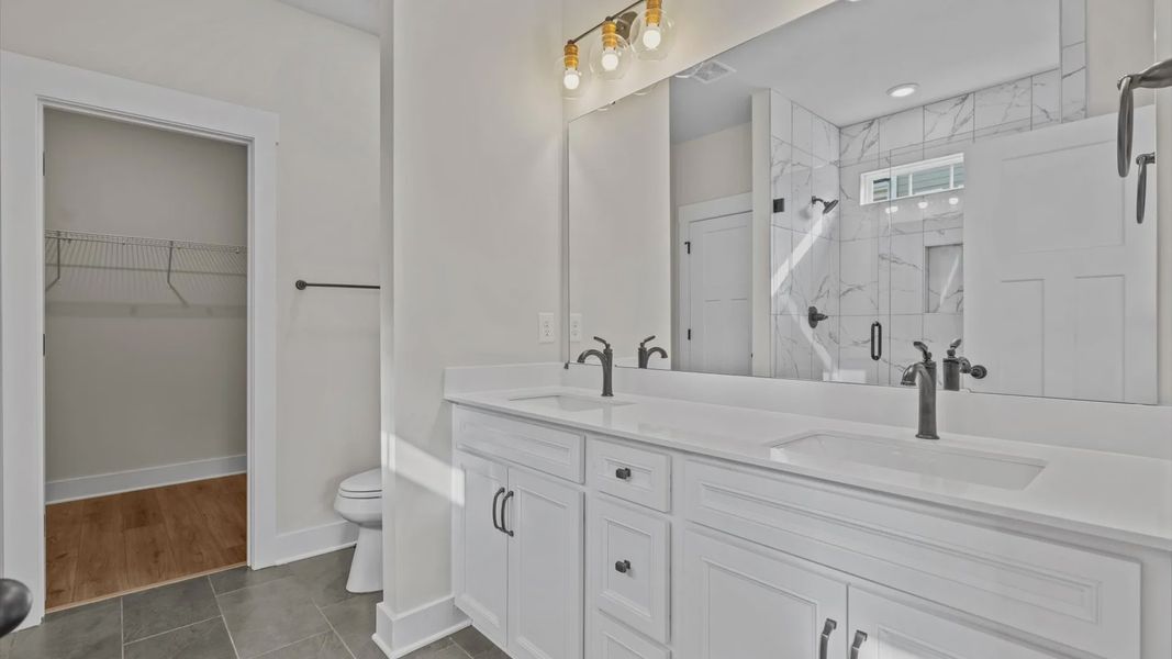 Owner's bathroom in a blue and grey ranch style home