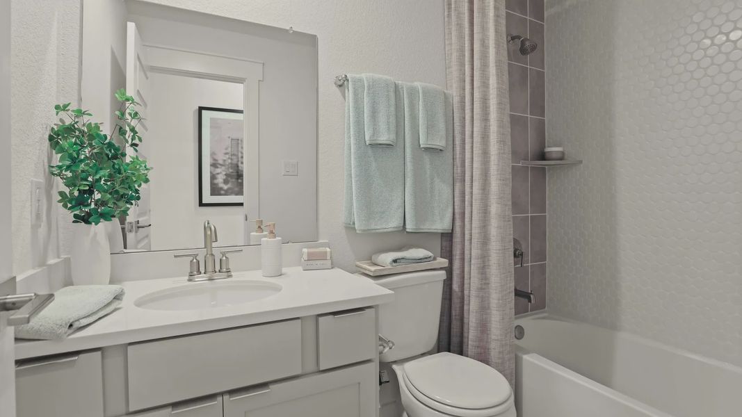 Experience refined elegance with chic white tiles and sleek fixtures in a Mostyn Springs sanctuary. Experience refined elegance with chic white tiles and sleek fixtures in a Mostyn Springs sanctuary.