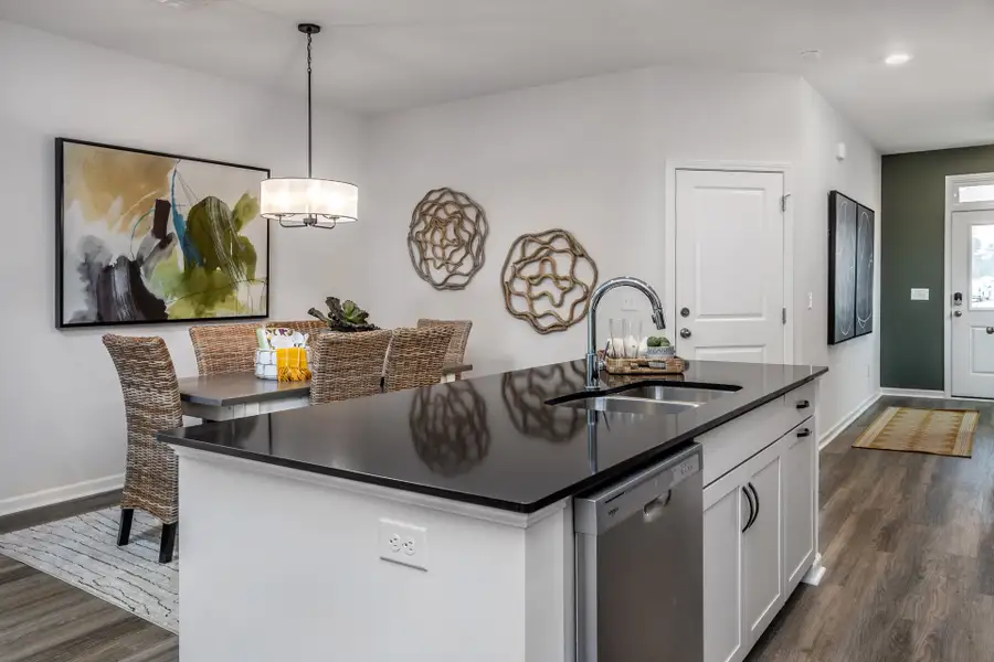 Furnished interior in a model home at Coastal Haven Townes in Leland (Image 3).