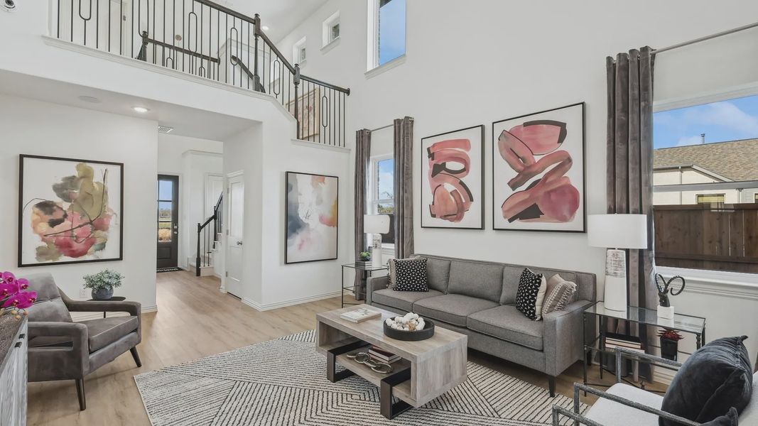 Experience luxury with soaring ceilings, sleek iron railing, and curated artwork in Bel Air Village.