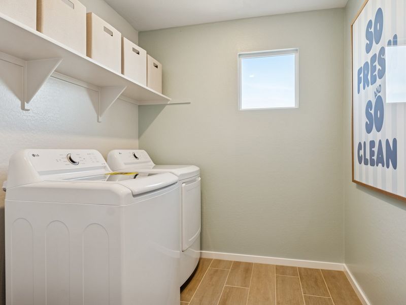 A room with a white wall and a white cabinet with a white window.