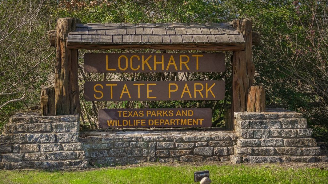 Entrance to the Bollinger community in Maxwell, TX, featuring signage and landscaping (Image 12). Entrance to the Bollinger community in Maxwell, TX, featuring signage and landscaping (Image 12).