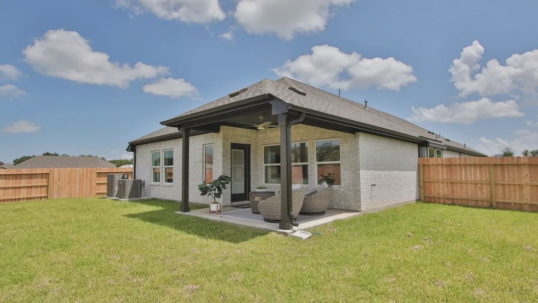 Elegant brick patio with pergola, featuring chic rattan seating. Located in Ellis Cove, showcasing refined outdoor living. Elegant brick patio with pergola, featuring chic rattan seating. Located in Ellis Cove, showcasing refined outdoor living.
