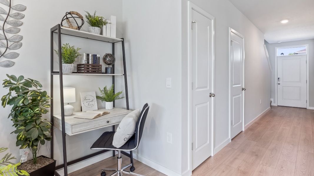 Furnished interior in a model home at Asher Park in Lehigh Acres (Image 10).