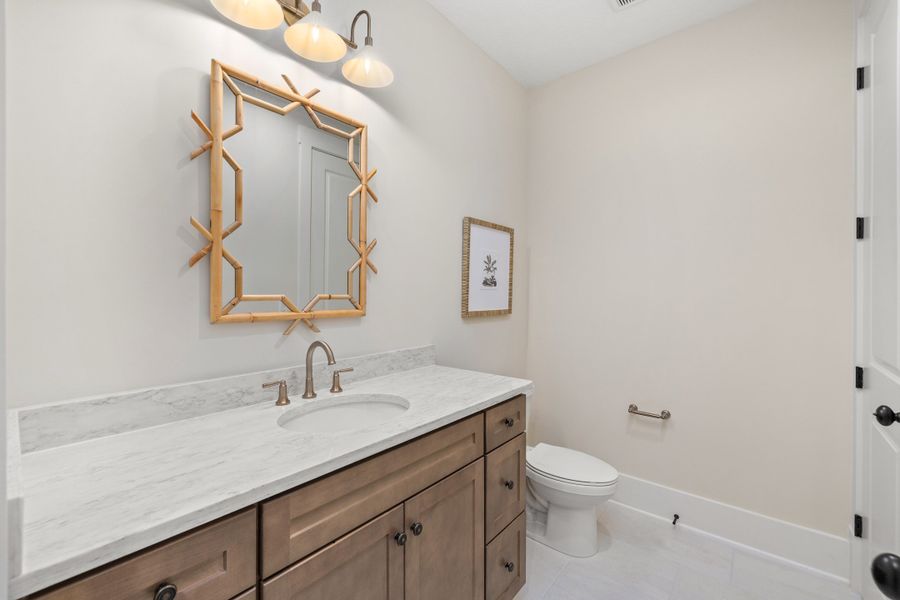 Furnished interior in a model home at Hidden Creek at SilverLeaf 80' Gold Series in St. Augustine (Image 75).