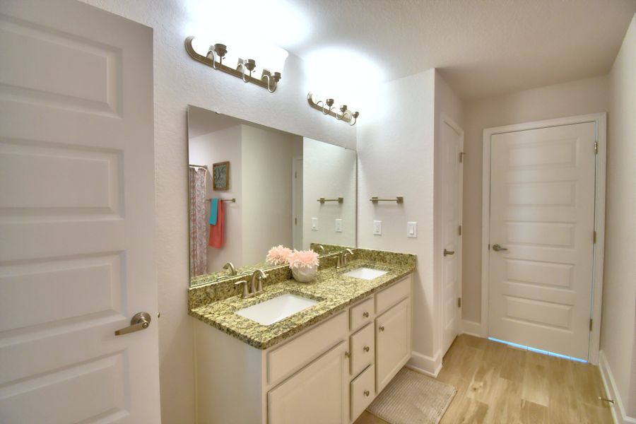 Furnished interior in a model home at Citrus Landing in Davenport (Image 39).