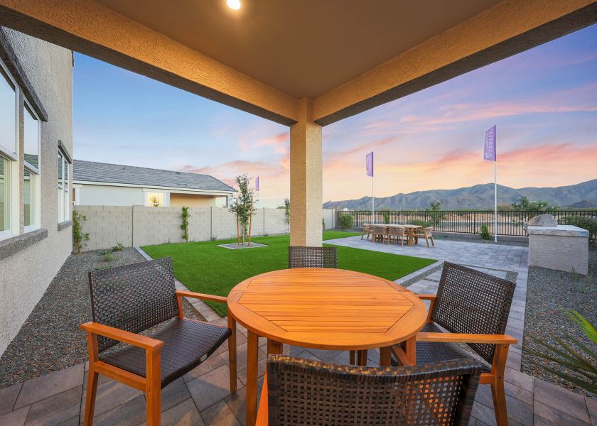 A table and chairs on a patio. A table and chairs on a patio.