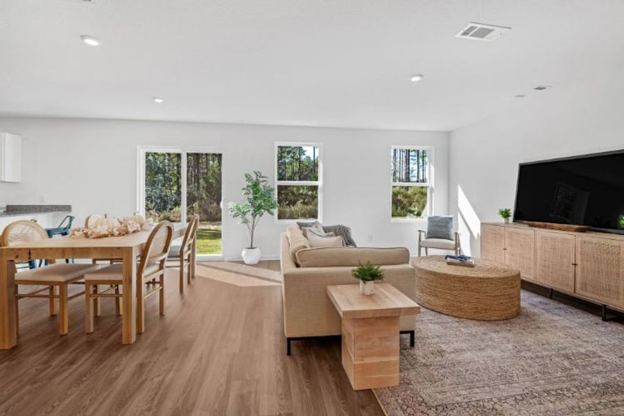 A living room with a couch and a table. A living room with a couch and a table.
