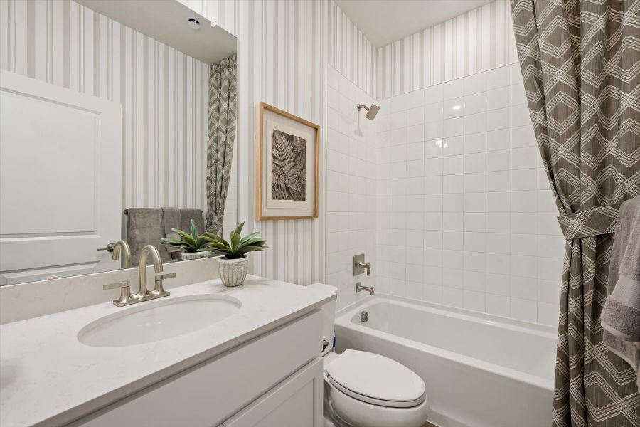 A bathroom with a sink and a toilet. A bathroom with a sink and a toilet.
