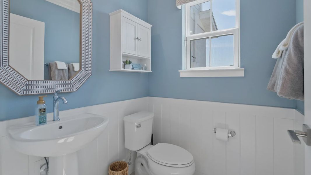 Cyrene at Harmony by DRB Homes includes a downstairs half bathroom with a window—adding natural light and style to the space. Cyrene at Harmony by DRB Homes includes a downstairs half bathroom with a window—adding natural light and style to the space.