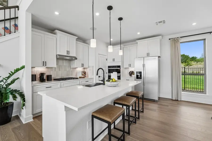 Furnished interior in a model home at Saddle Ridge at Wildhorse Ranch in Manor (Image 9).