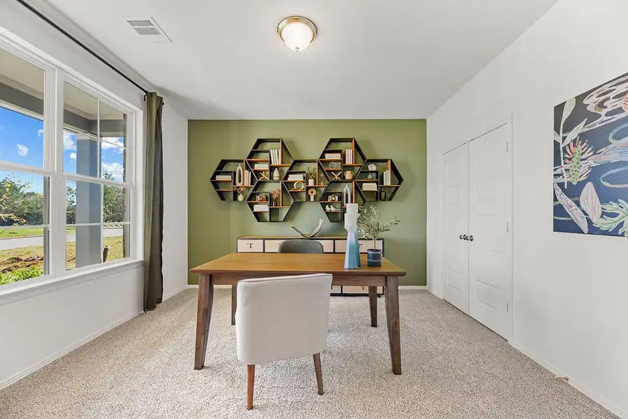 A room with a table and chairs. A room with a table and chairs.