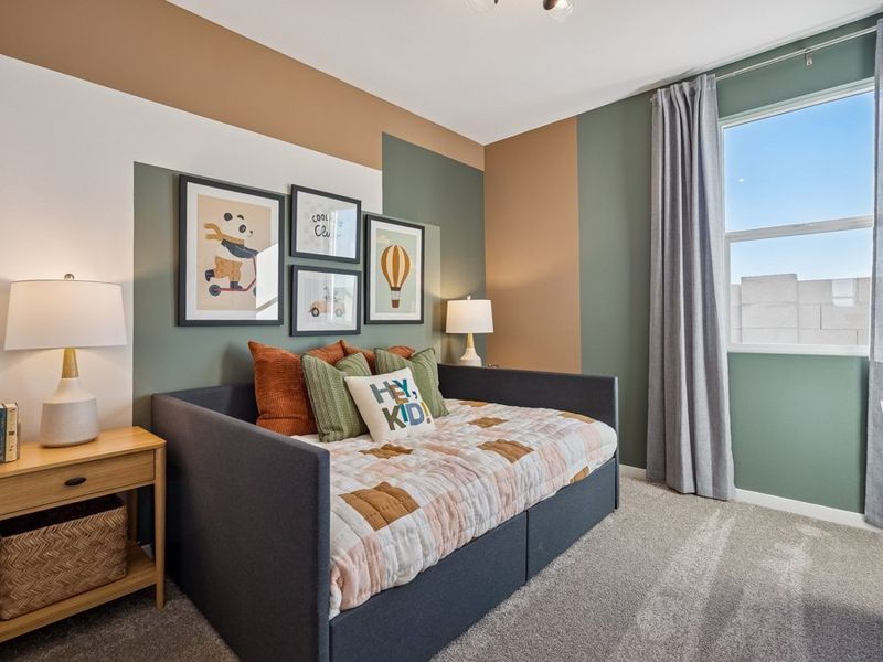 A bedroom with a bed and a window. A bedroom with a bed and a window.