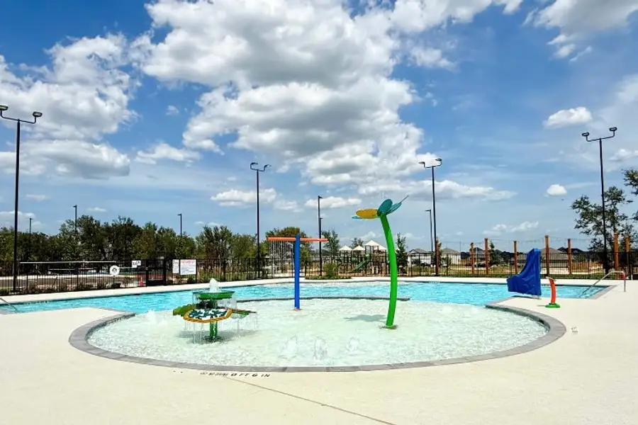 A water park with a green statue. A water park with a green statue.