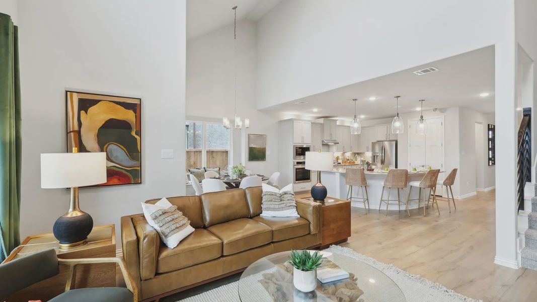 Luxurious vaulted ceilings and chic interiors grace this Wildflower Ranch home, enhancing elegance. Luxurious vaulted ceilings and chic interiors grace this Wildflower Ranch home, enhancing elegance.