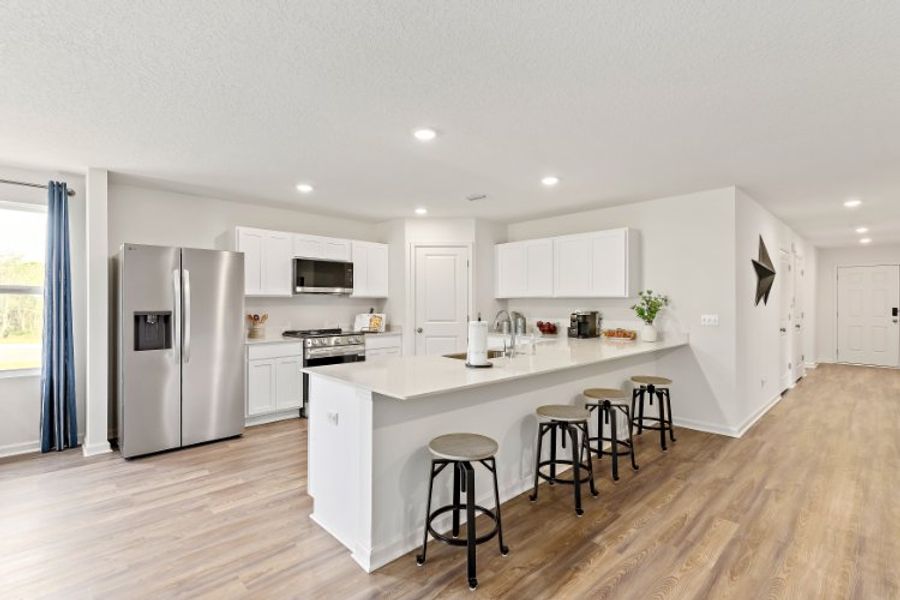 A kitchen with white cabinets. A kitchen with white cabinets.