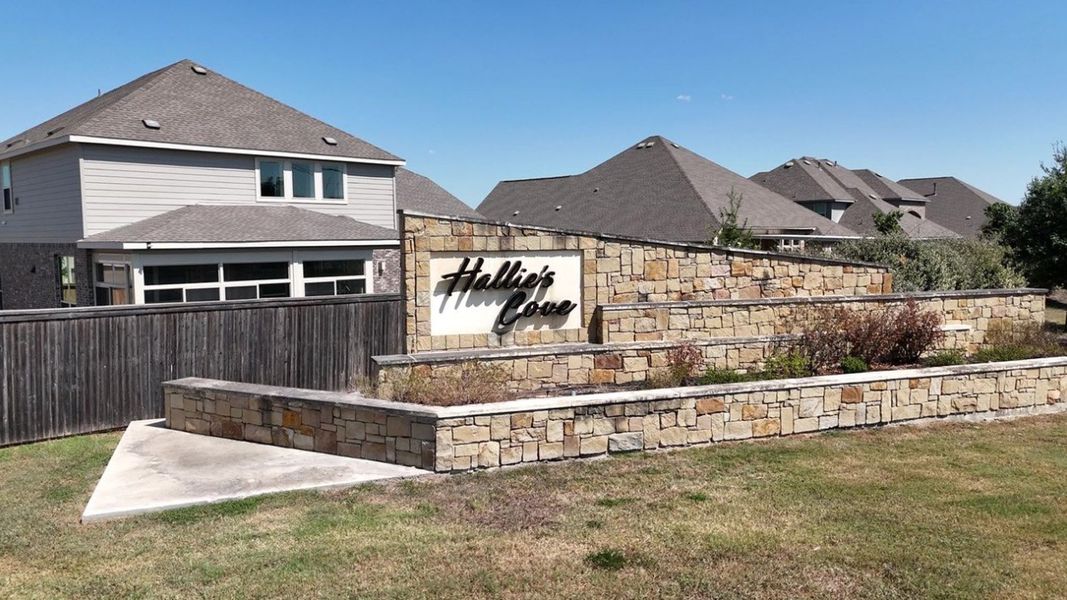 Entrance to the Hallie's Cove community in Schertz, TX, featuring signage and landscaping (Image 2).