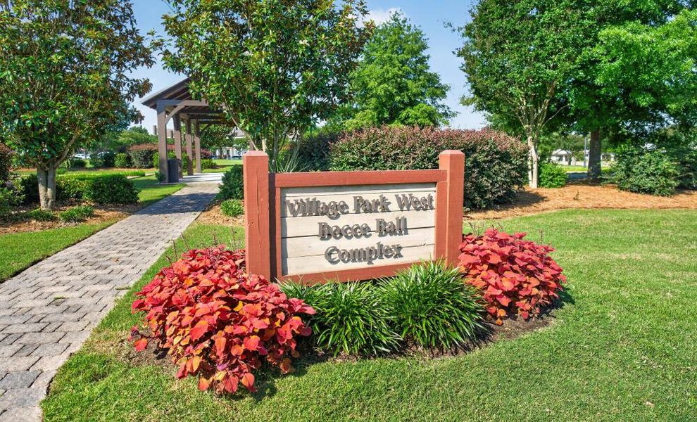 Entrance to the True Cedar at Woodside Plantation community in Aiken, SC, featuring signage and landscaping (Image 11).