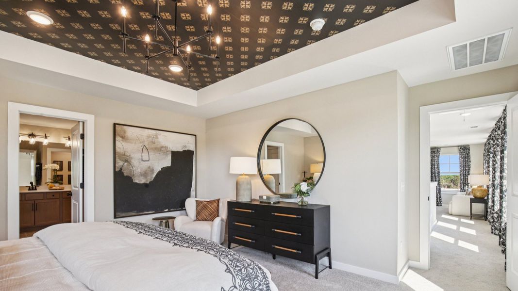 Large private bedroom located between loft area and primary suite bath