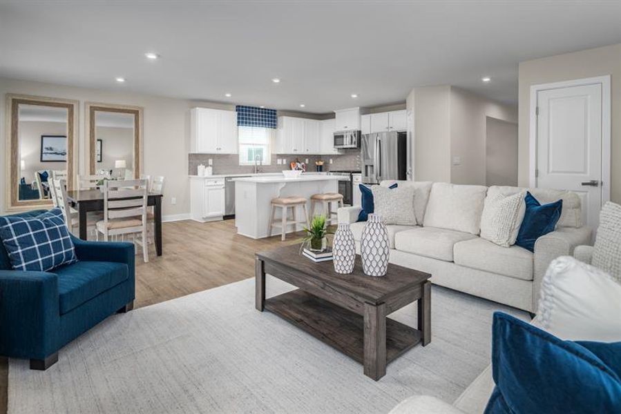 Furnished interior in a model home at Lakes At Riverbend Ranches in Navassa (Image 6).