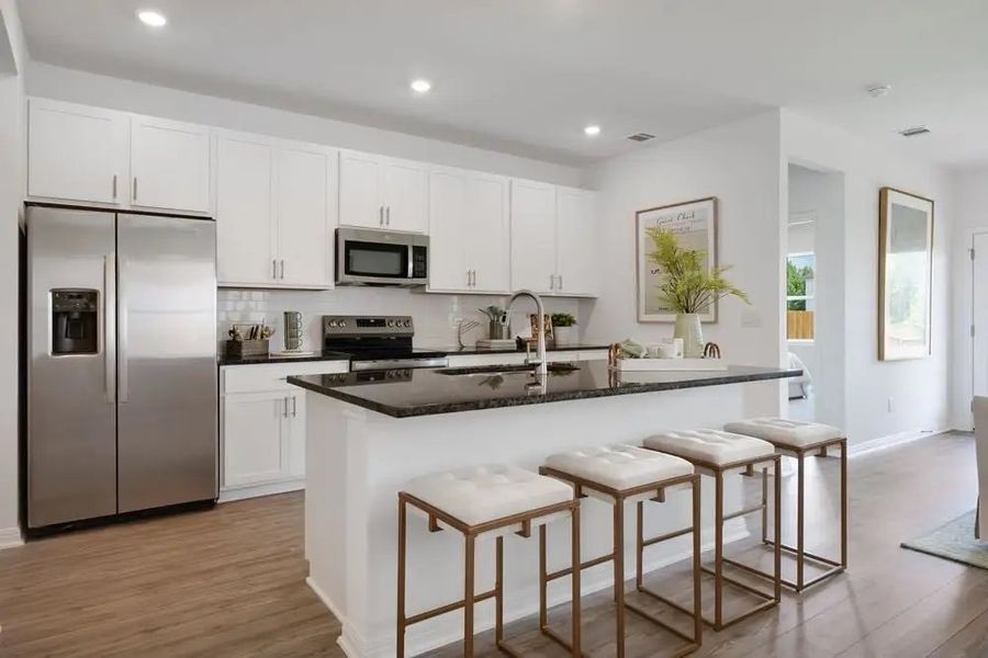 Furnished interior in a model home at Village Grove in Dripping Springs (Image 14).