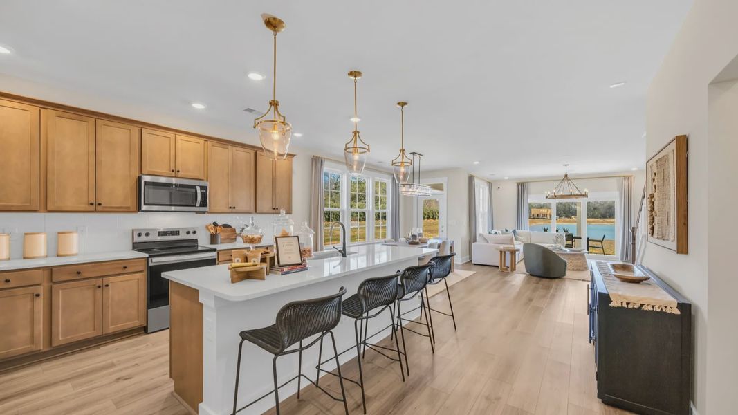 Kitchen in Chestnut Farms in by DRB homes offering an open layout
