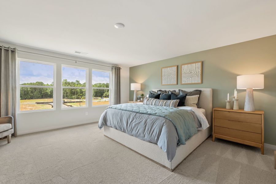 A bedroom with a large bed.