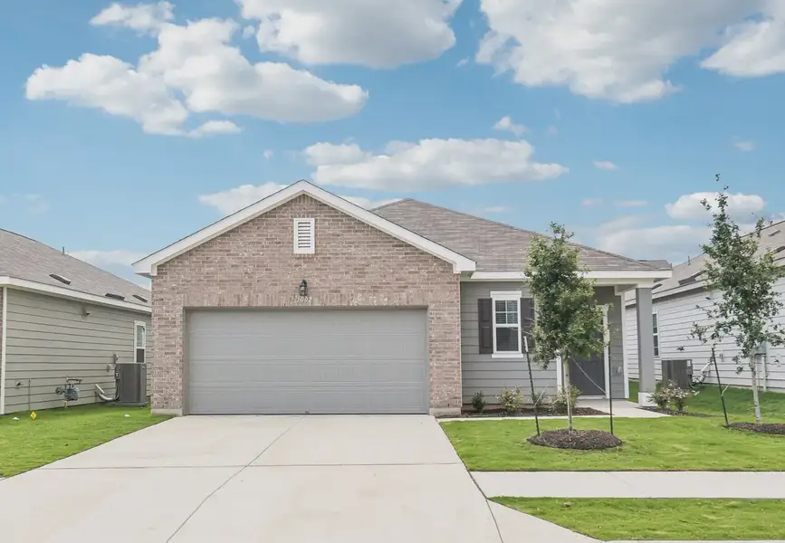 Front exterior of a home in the Rolling Glen community, located in Hutto, TX (Image 9).