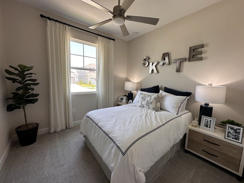 A cozy bedroom featuring a white bed, modern decor, and ample natural light, creating a serene ambiance. A cozy bedroom featuring a white bed, modern decor, and ample natural light, creating a serene ambiance.