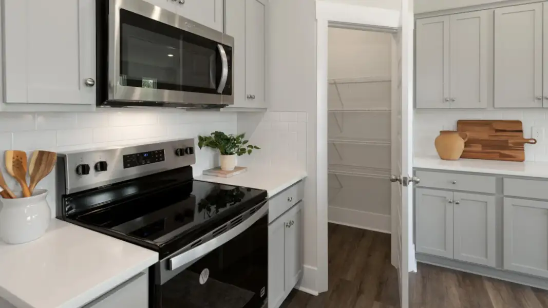 Furnished interior in a model home at The Retreat at Indigo Preserve Townhomes in Leland (Image 11).