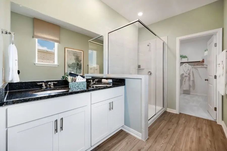 Furnished interior in a model home at Village Grove in Dripping Springs (Image 19).